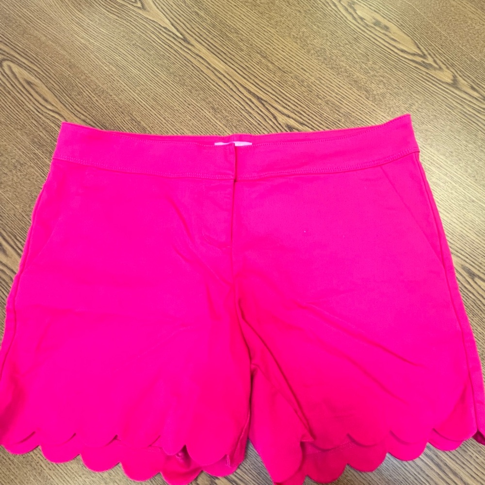 Hot pink shorts.